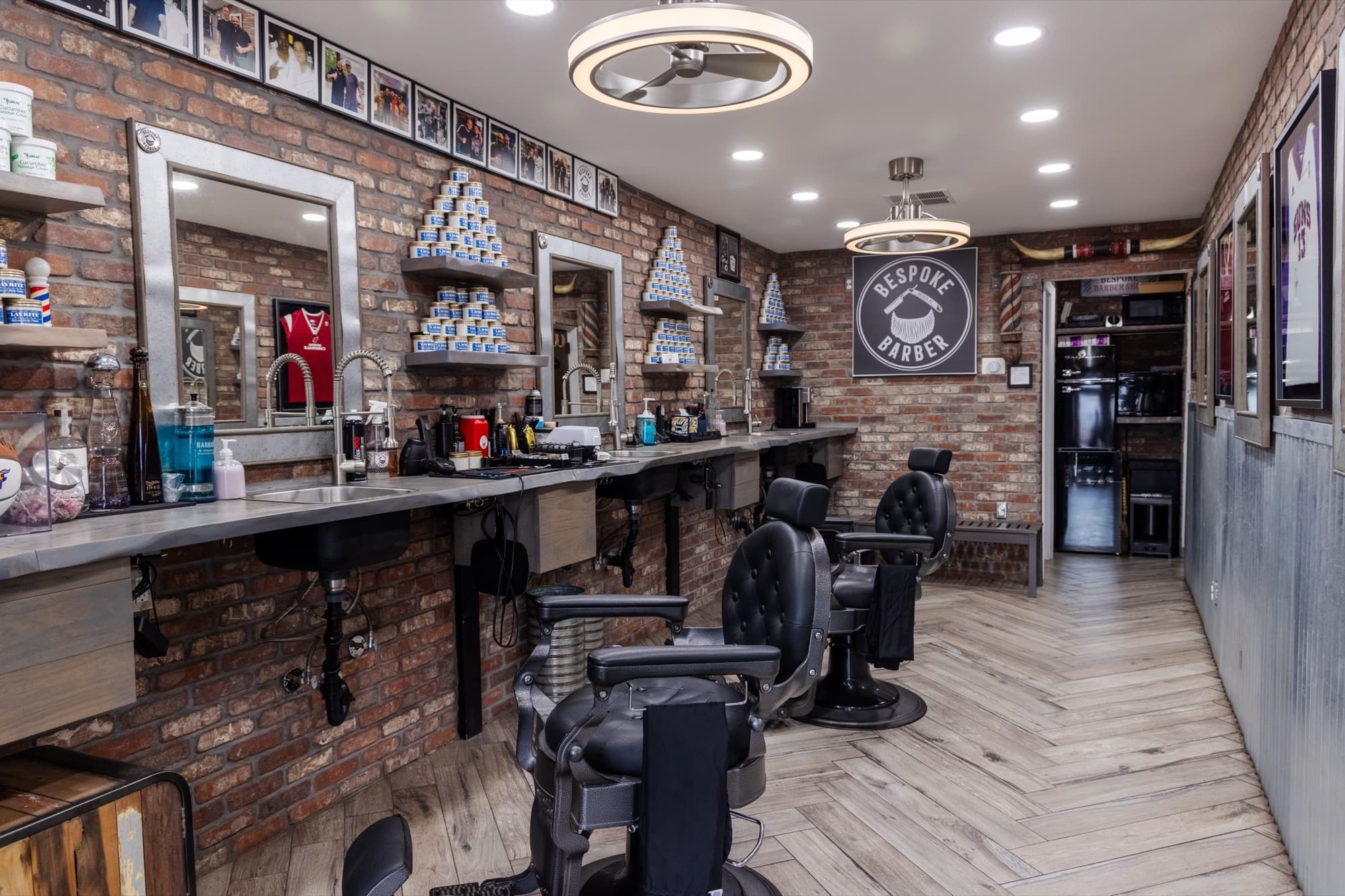 Bespoke Barber shop interior in Arcadia, Phoenix — exposed brick, classic chairs, precision lighting