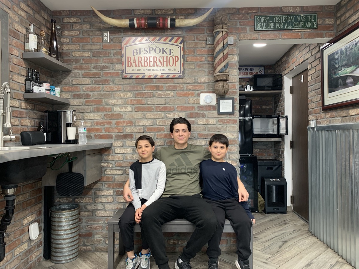 Boys sitting on the bench waiting their turn at Bespoke Barber