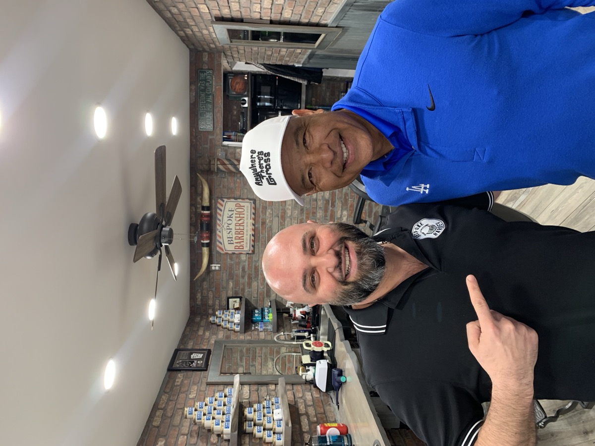 Client in Dodgers cap getting the Bespoke Barber treatment